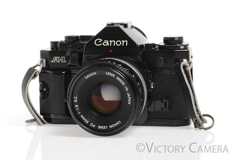 Canon A-1 Black 35mm Camera w/ 50mm F1.8 Lens &amp; Grip -New Seals, No Squeak- - Victory Camera